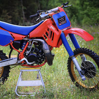 Custom racing number stickers with name and flag for dirt bikes and motocross, featuring solid color vinyl decals by MC Motoparts.