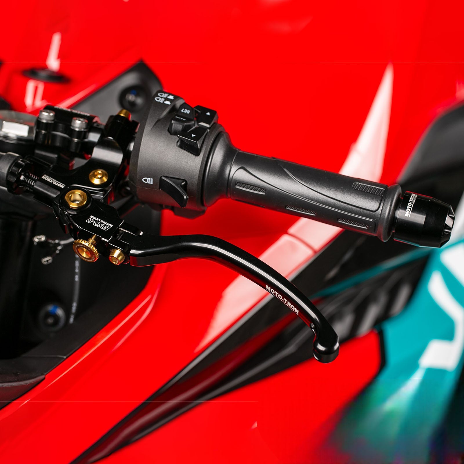 Moto-Tron lightweight racing folding clutch lever installed on BMW S1000RR motorcycle, designed for enhanced performance and durability.