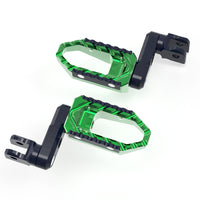 Front view of MC Motoparts 40mm extension wide foot pegs for Kawasaki Ninja 650R 300 400 TRC touring motorcycle.