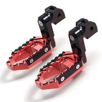 Black MC Motoparts 40mm extension foot pegs for Aprilia Mana 850, RSV4, and TRC touring models, with adjustable wide design.
